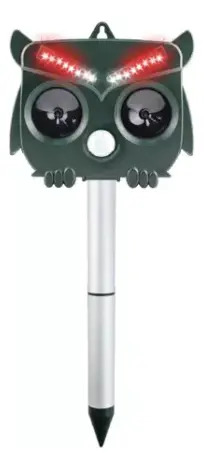 Repelente ultrasónico para pájaros con forma de búho verde, ojos iluminados en rojo y base puntiaguda