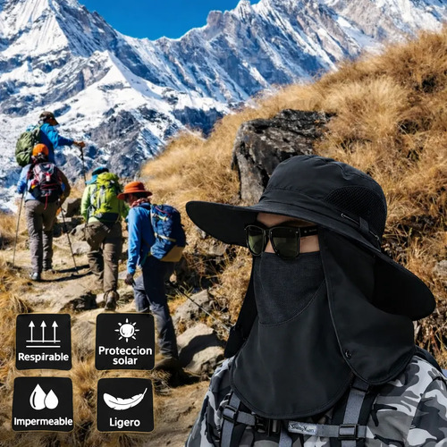 Persona haciendo trekking en la montaña con un sombrero con cubrecara y cubrenuca